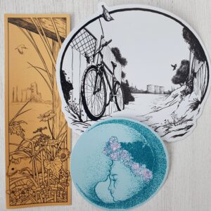 Image shows three sticker designs from issue three; the tall yellow front cover design with edgeland weeds and mouse; a design from the ruderal garden with bicycle leaning against fence, and the soft forehead kiss from the poem 'abolition is our ocean calling'.